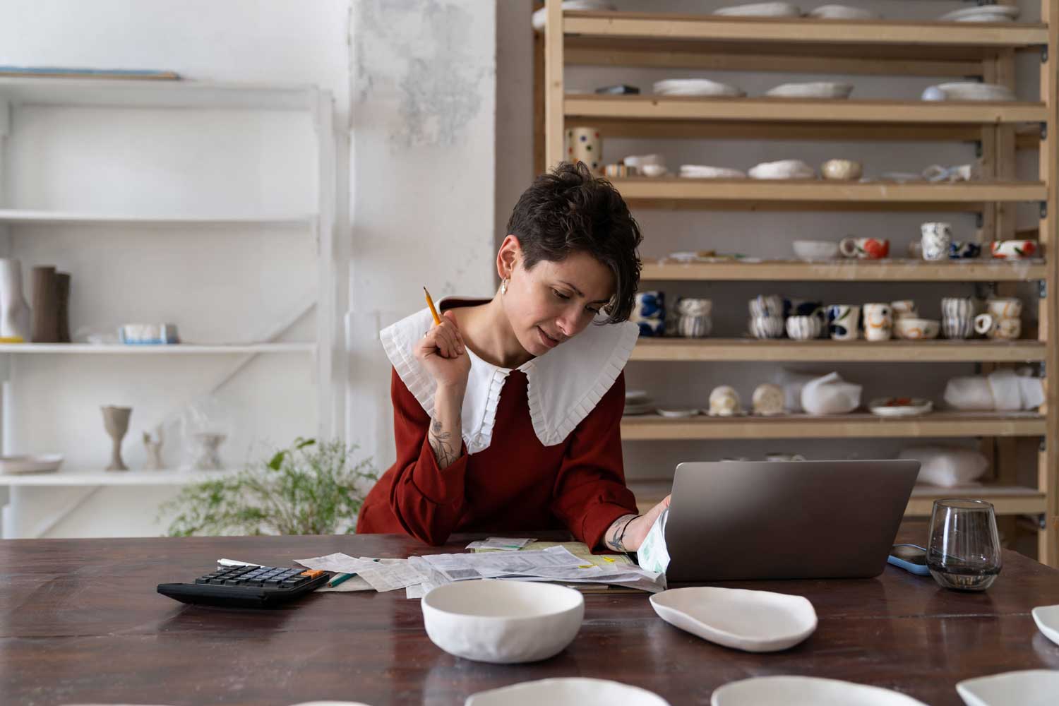 Woman calculating tax debts for loan amount